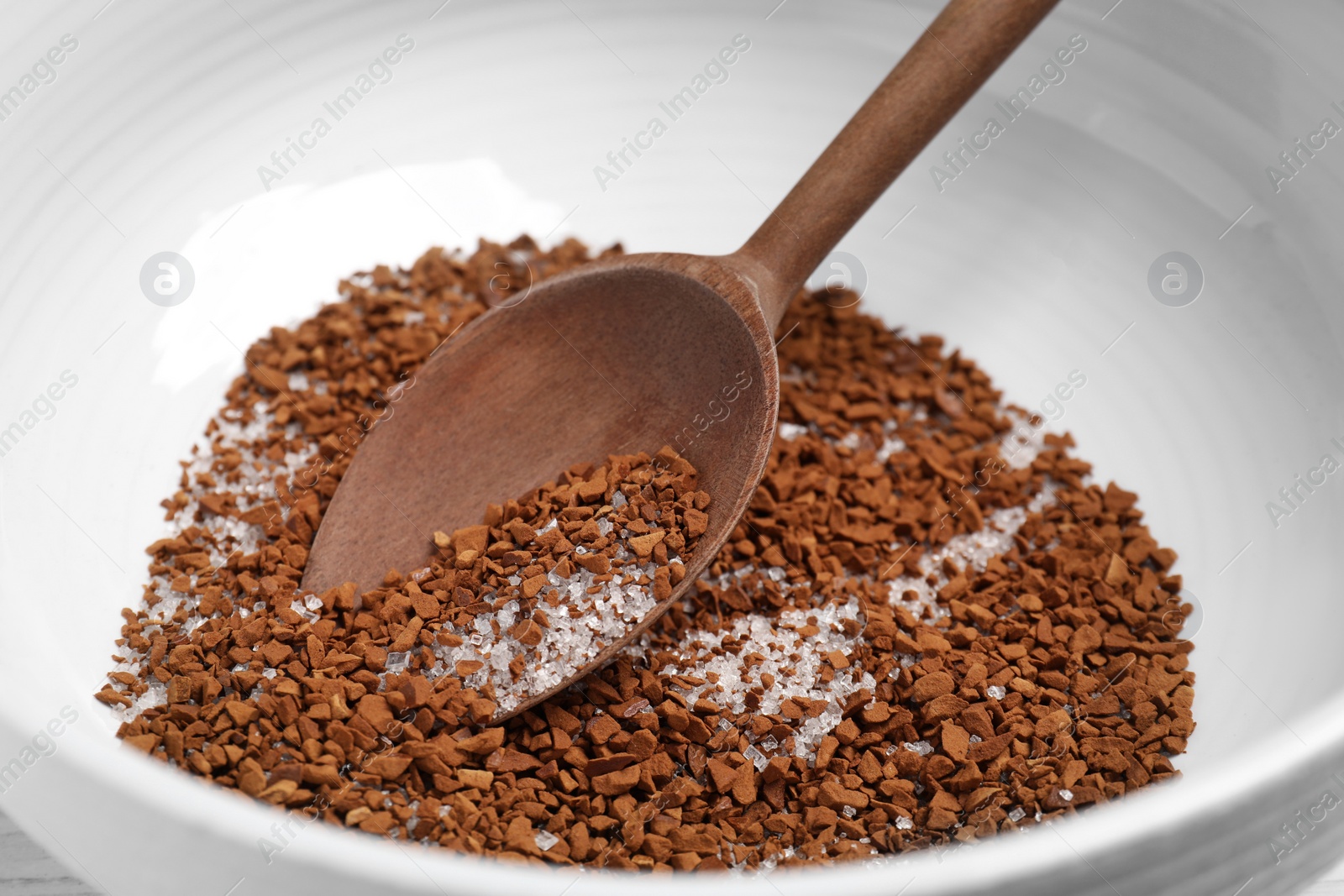 Photo of Bowl with instant coffee, sugar and spoon, closeup