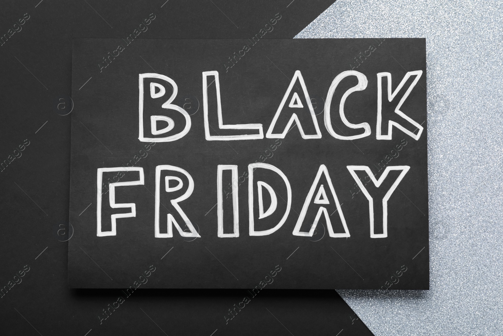 Photo of Card with words Black Friday on color background, top view