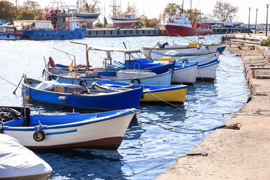 Picturesque view of port with moored boats on sunny day