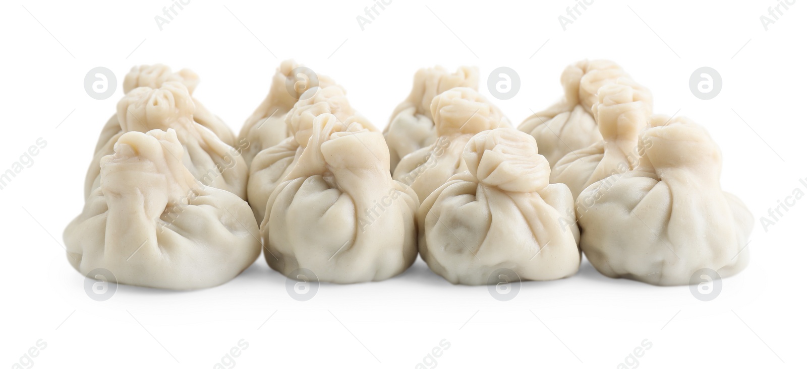 Photo of Many tasty khinkali (dumplings) isolated on white. Georgian cuisine