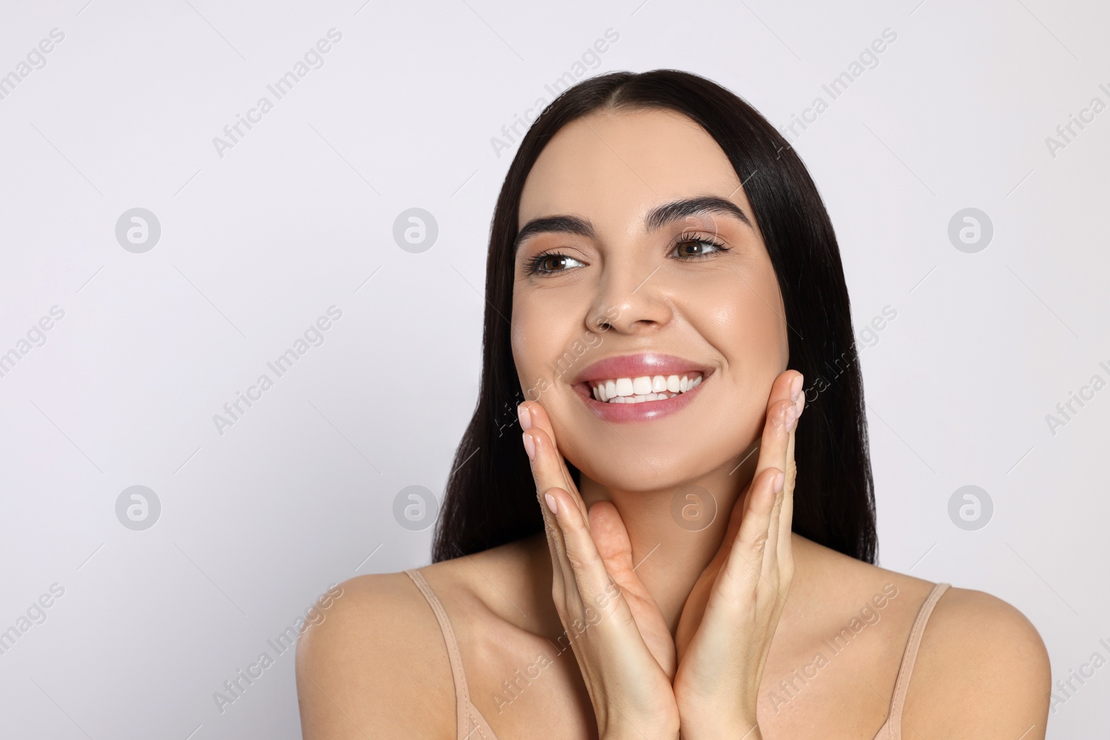 Photo of Portrait of attractive young woman on light grey background, space for text. Spa treatment