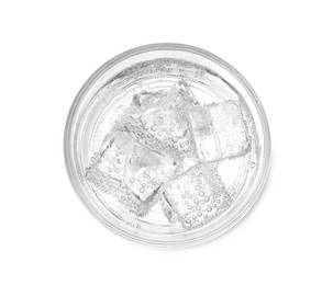 Photo of Glass of soda water with ice isolated on white, top view