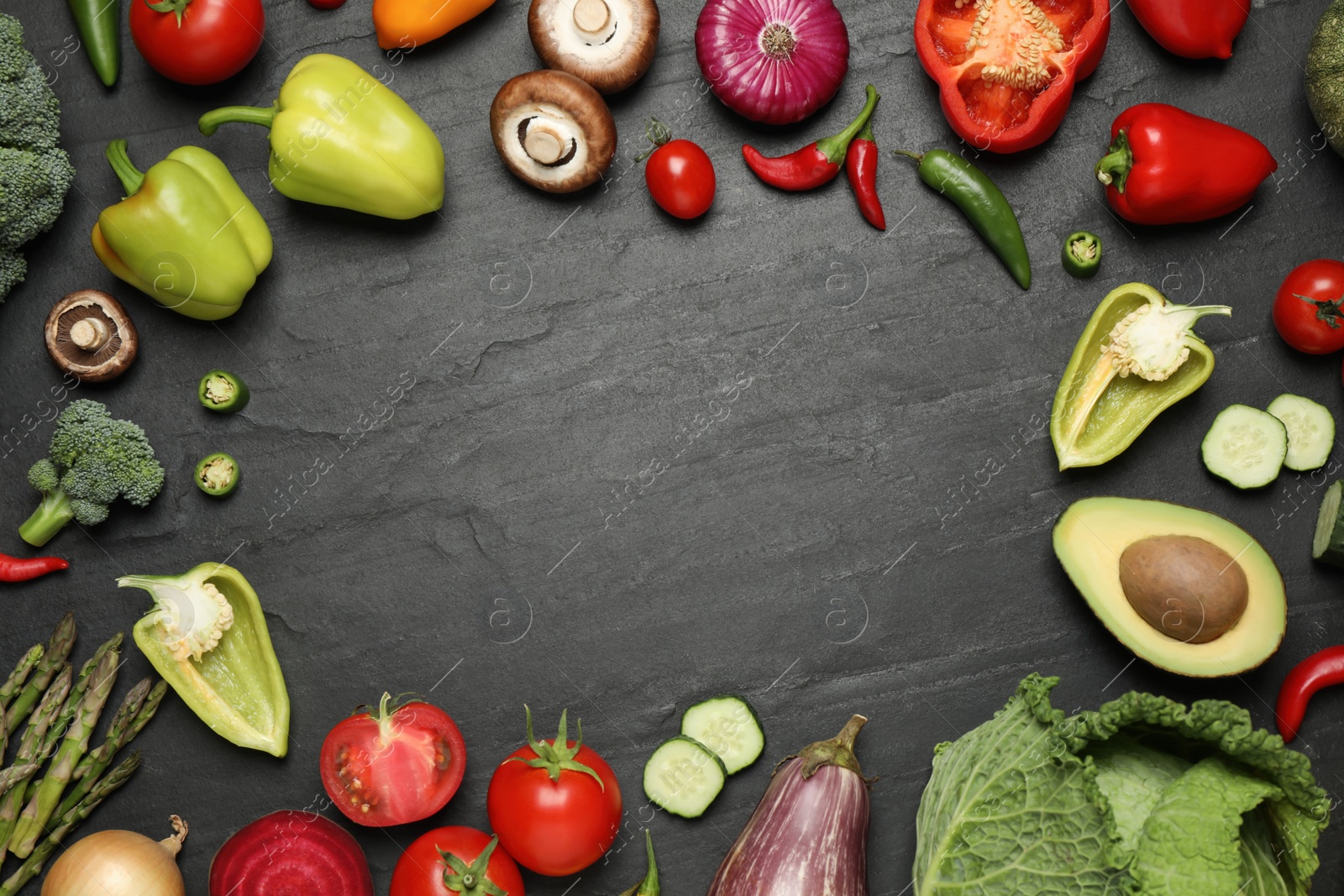 Photo of Frame of fresh vegetables on black table, flat lay. Space for text