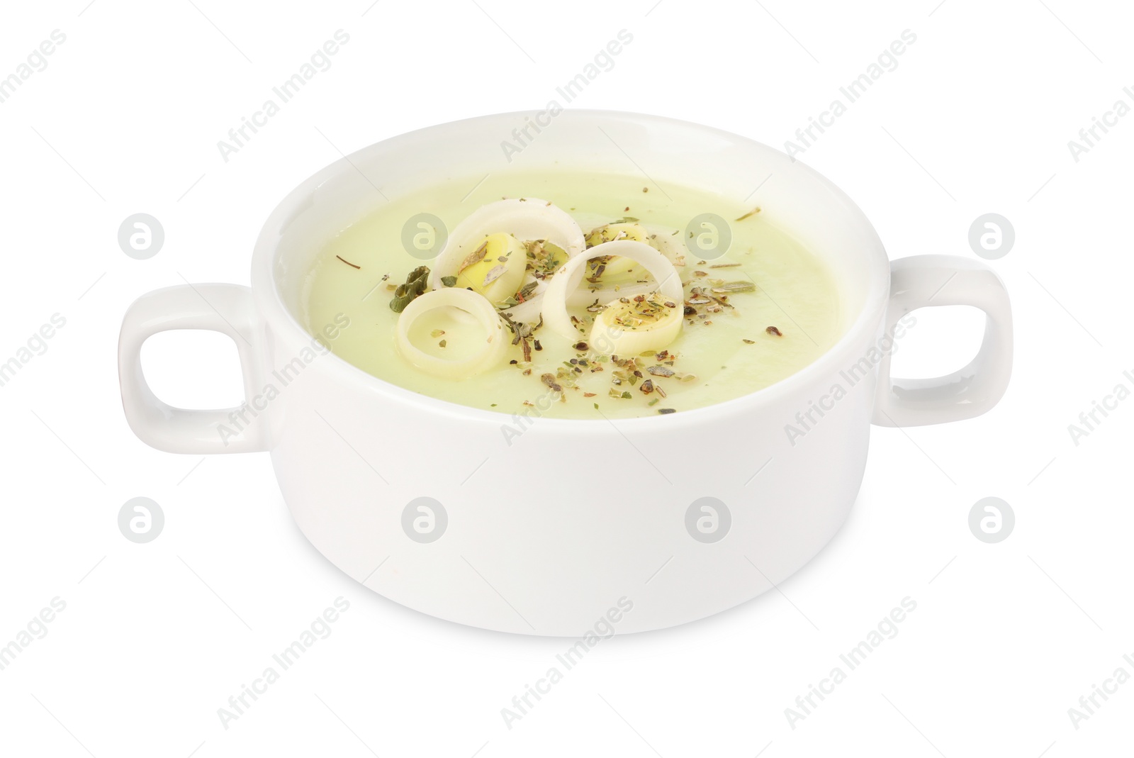 Photo of Delicious cream soup with leek and spices in bowl isolated on white