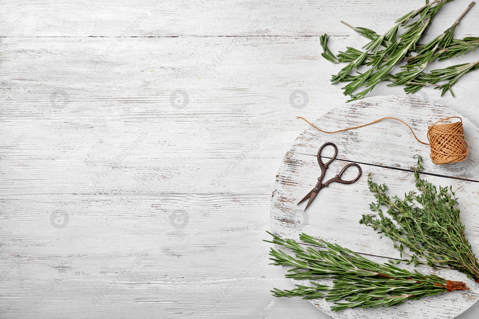 Photo of Flat lay composition with fresh green herbs on white wooden background