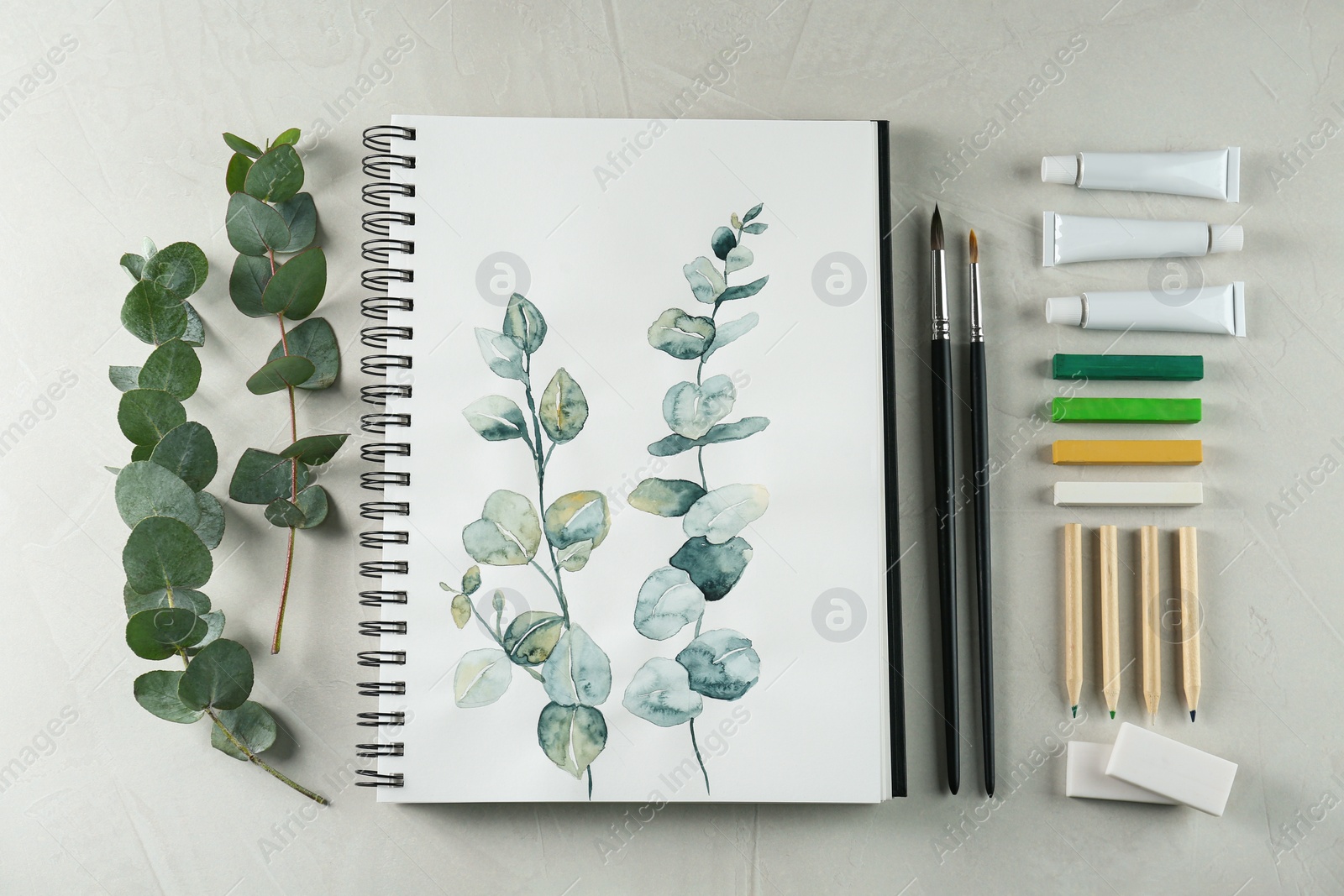 Photo of Flat lay composition with beautiful drawing of eucalyptus branches on white table