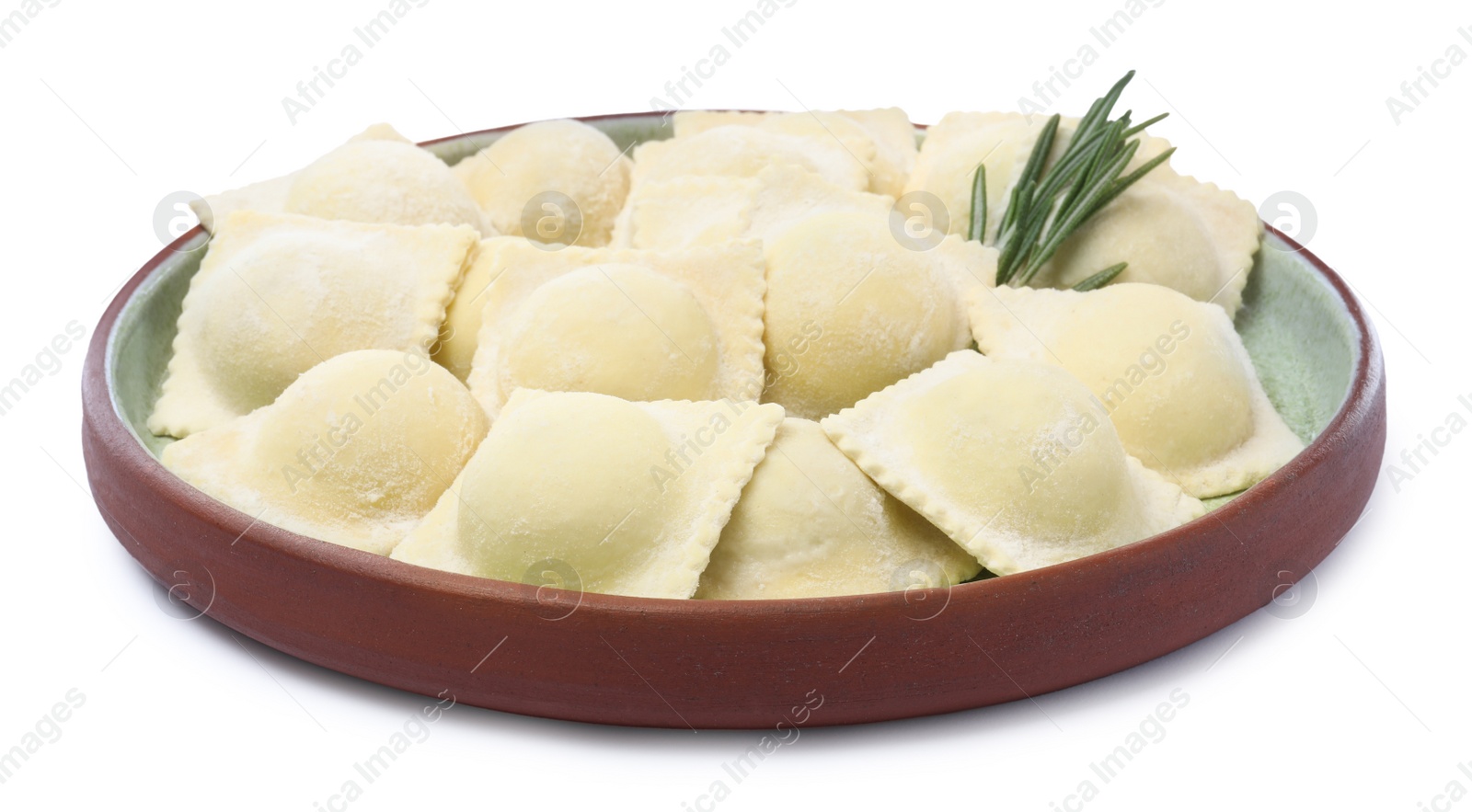 Photo of Uncooked ravioli and rosemary on white background