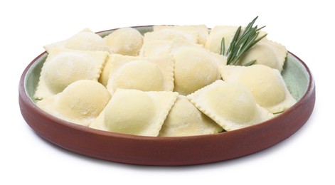 Uncooked ravioli and rosemary on white background