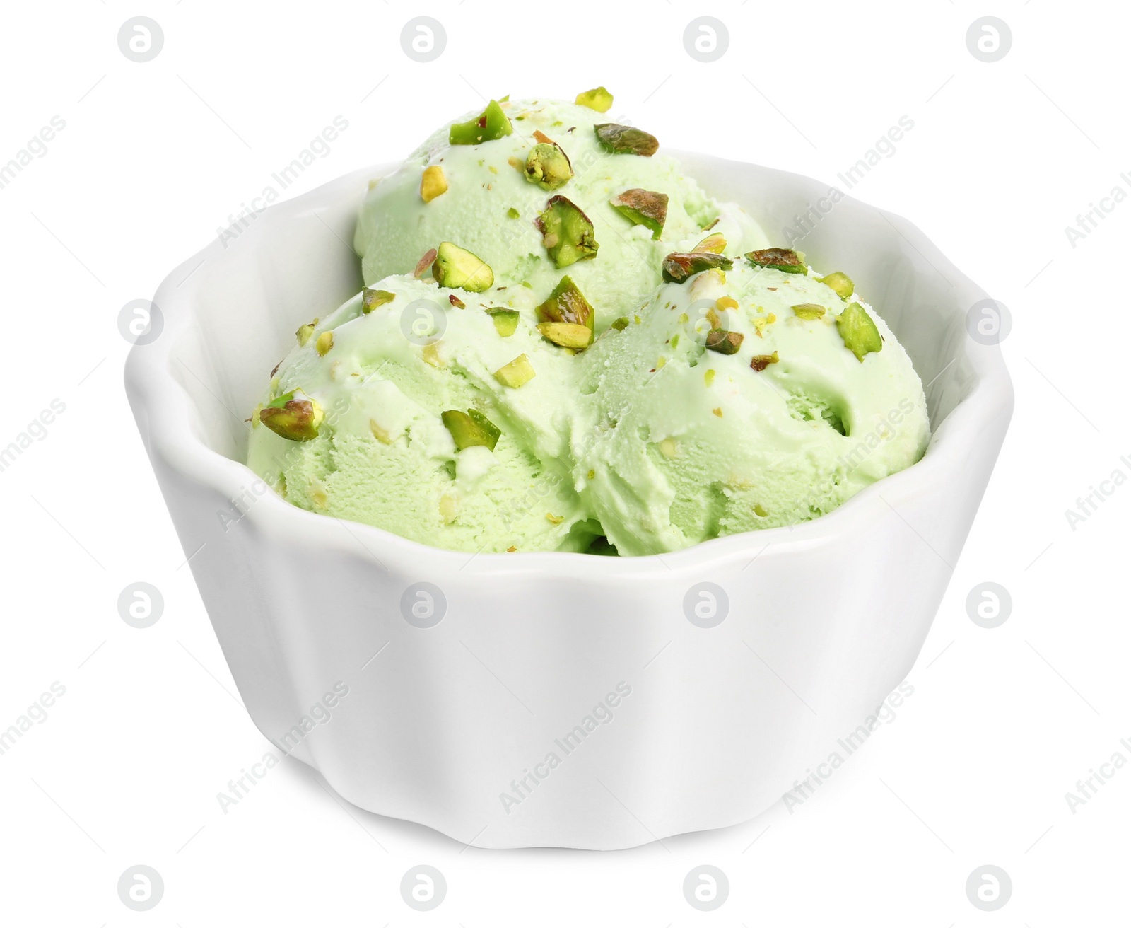 Photo of Bowl of sweet pistachio ice cream on white background
