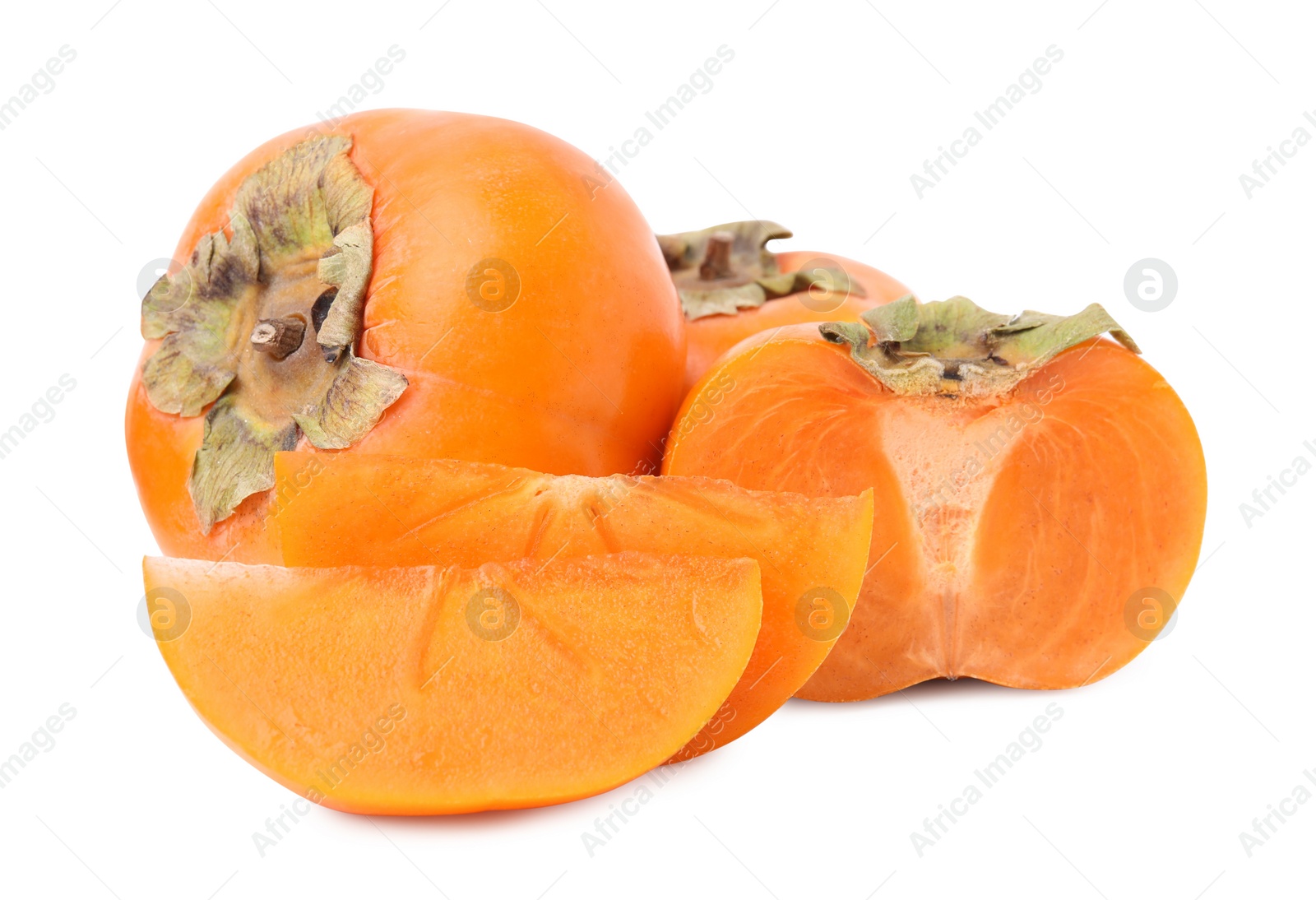 Photo of Whole and cut delicious ripe juicy persimmons on white background