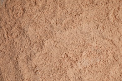 Loose face powder as background, top view