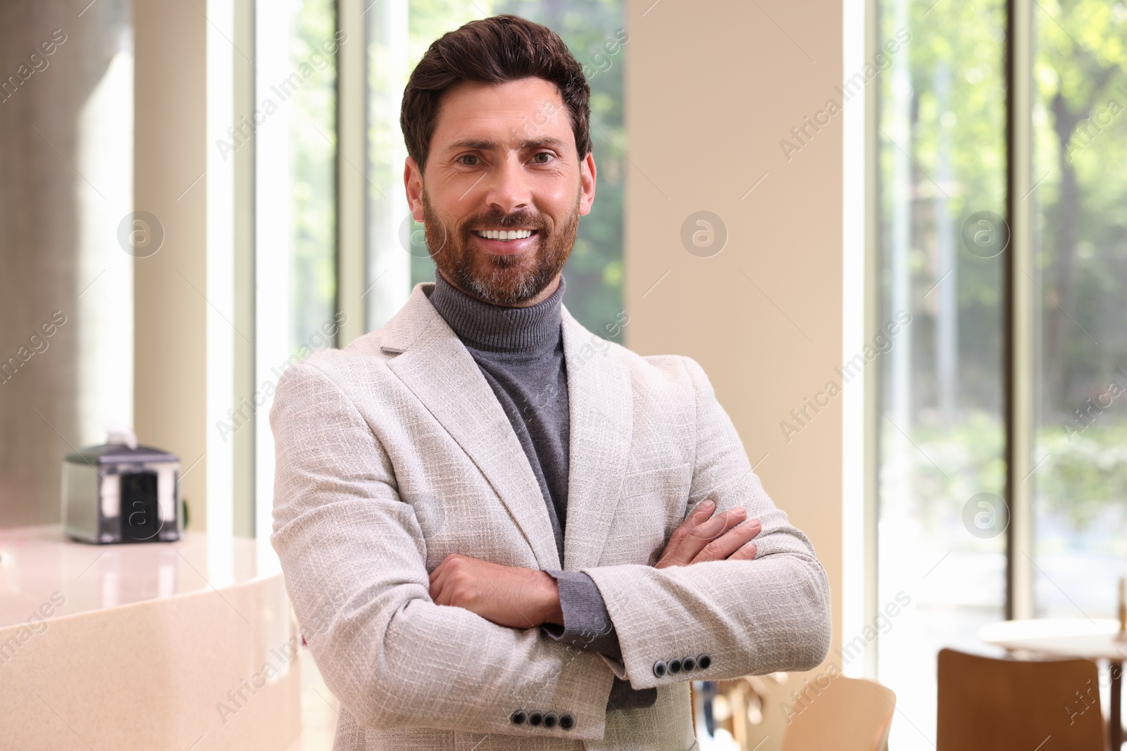 Photo of Portrait of handsome stylish man in office