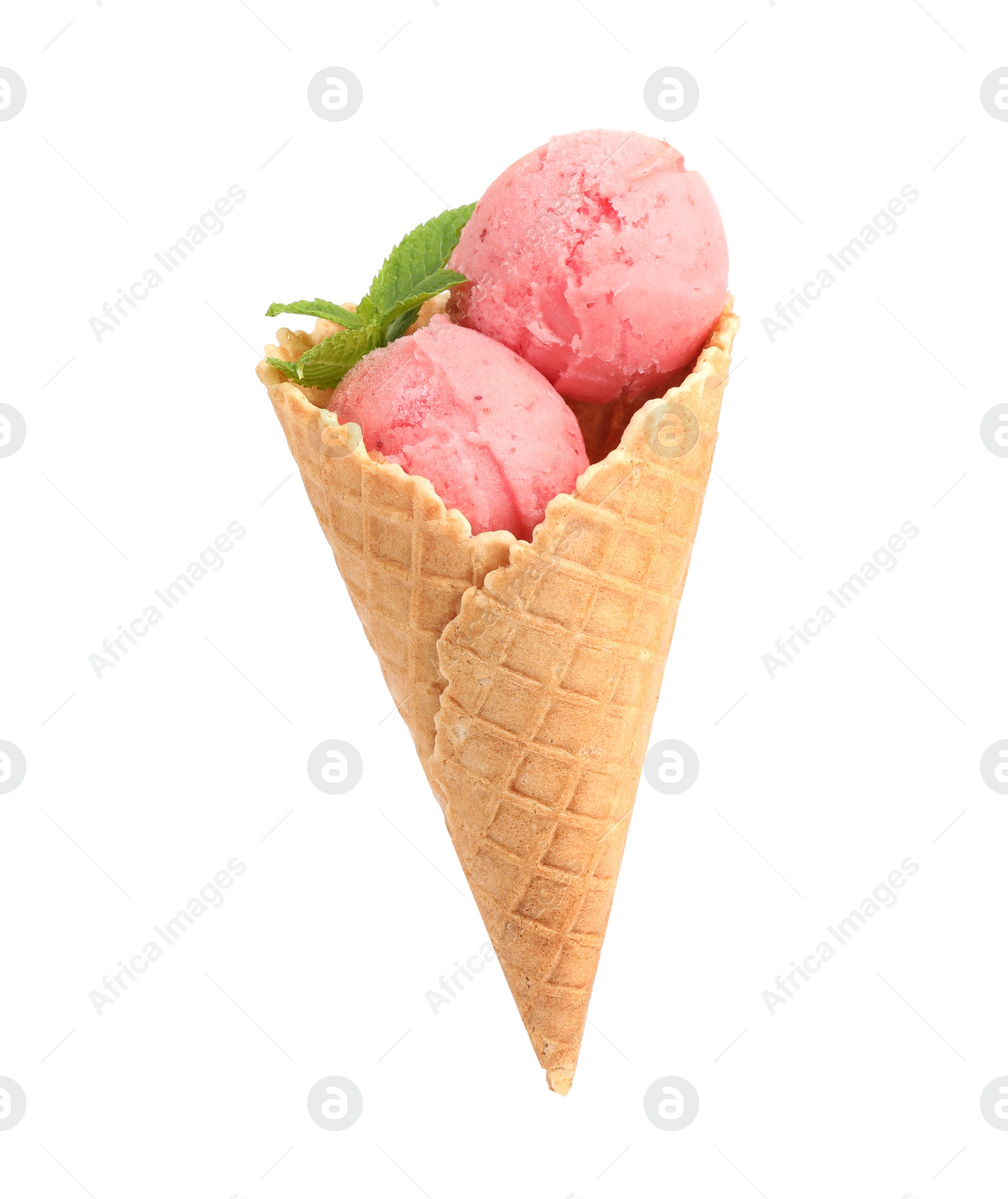 Photo of Delicious pink ice cream with mint in waffle cone on white background