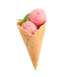 Photo of Delicious pink ice cream with mint in waffle cone on white background