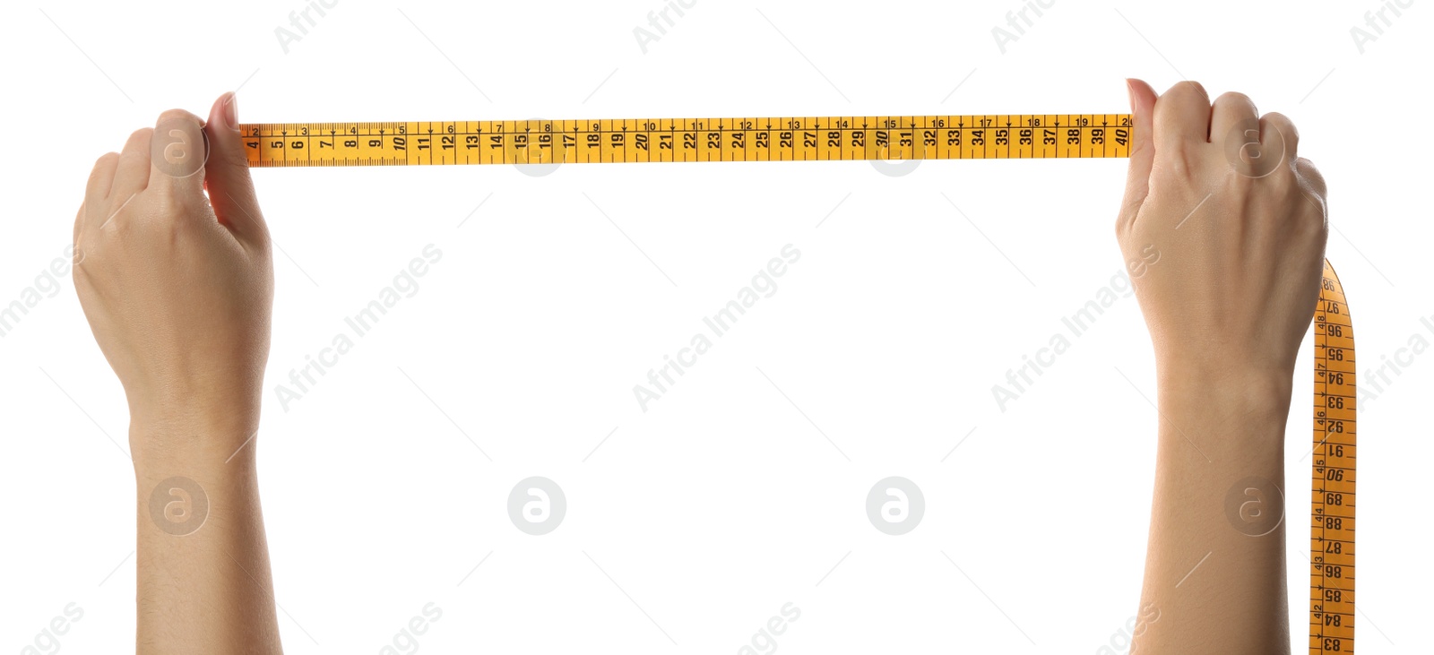 Photo of Woman holding yellow measuring tape on white background, closeup