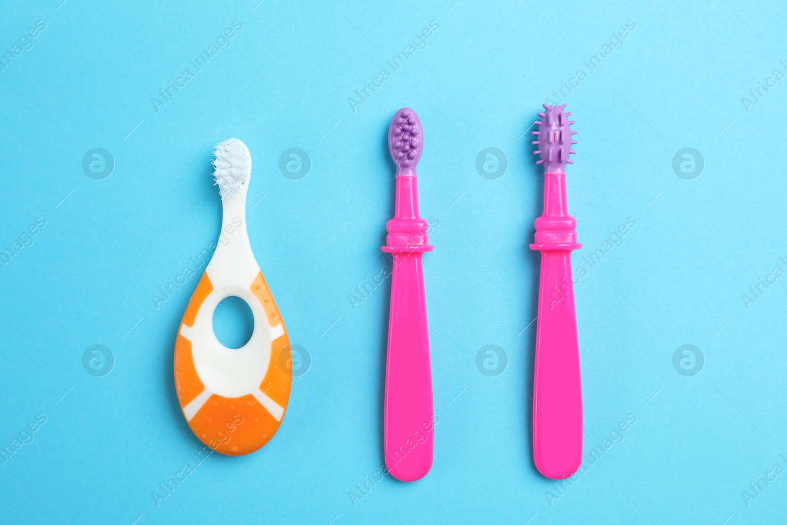 Photo of Manual toothbrushes for children on color background, top view