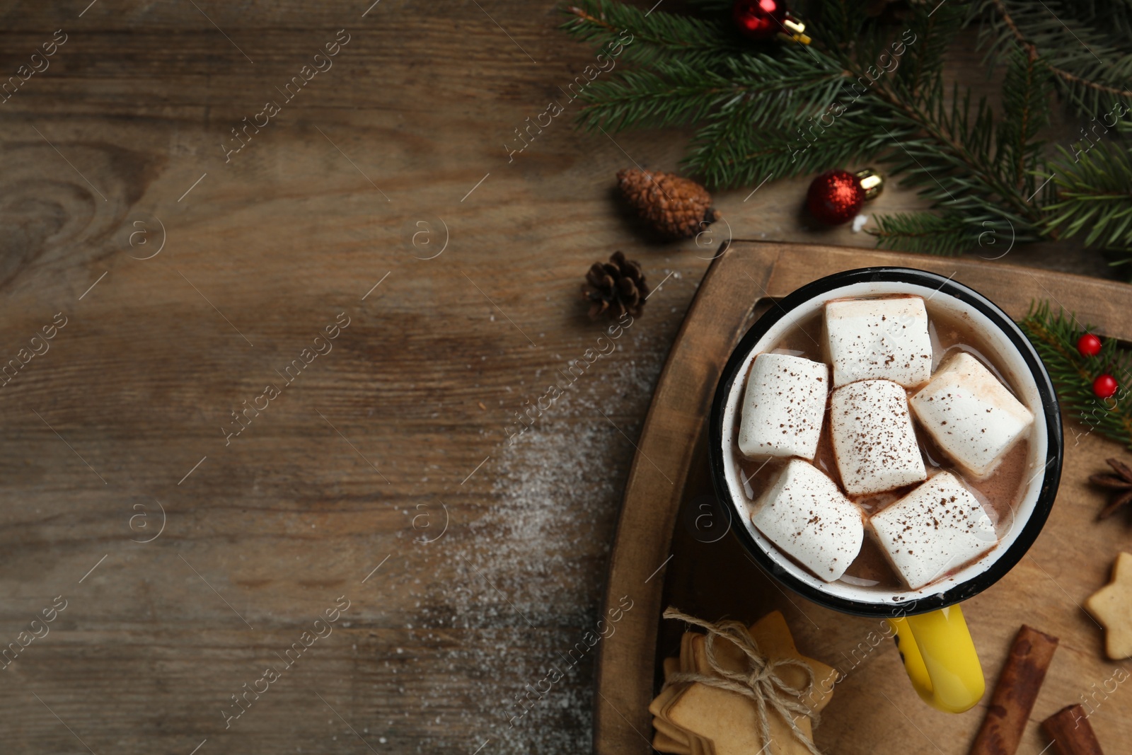 Photo of Flat lay composition with delicious marshmallow cocoa and Christmas decor on wooden table. Space for text