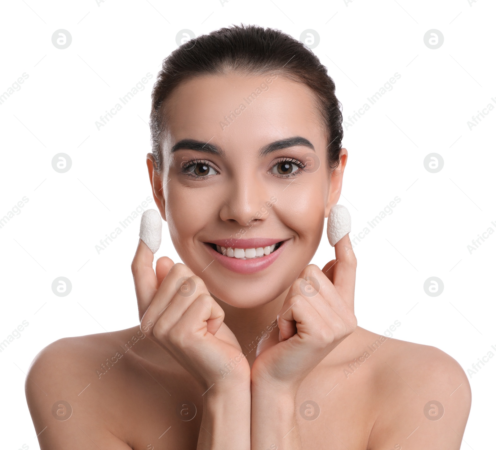 Photo of Woman using silkworm cocoons in skin care routine on white background