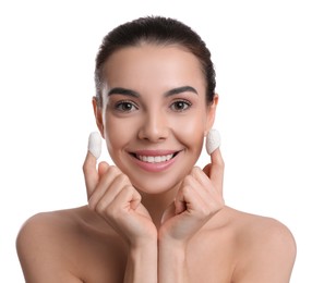 Woman using silkworm cocoons in skin care routine on white background