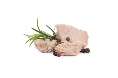 Photo of Delicious canned tuna chunks with rosemary and peppercorns isolated on white