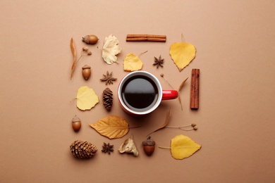 Flat lay composition with hot drink on beige background. Cozy autumn