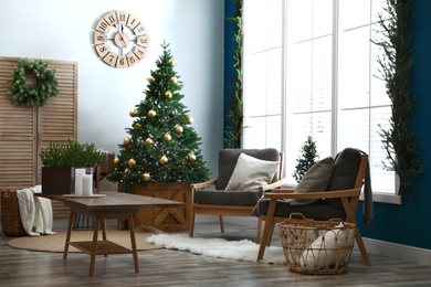 Photo of Beautiful interior with decorated Christmas tree in living room