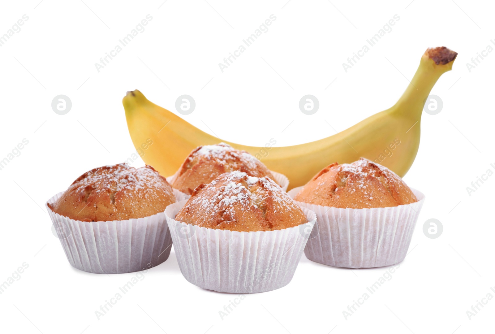 Photo of Tasty muffins and ripe banana on white background