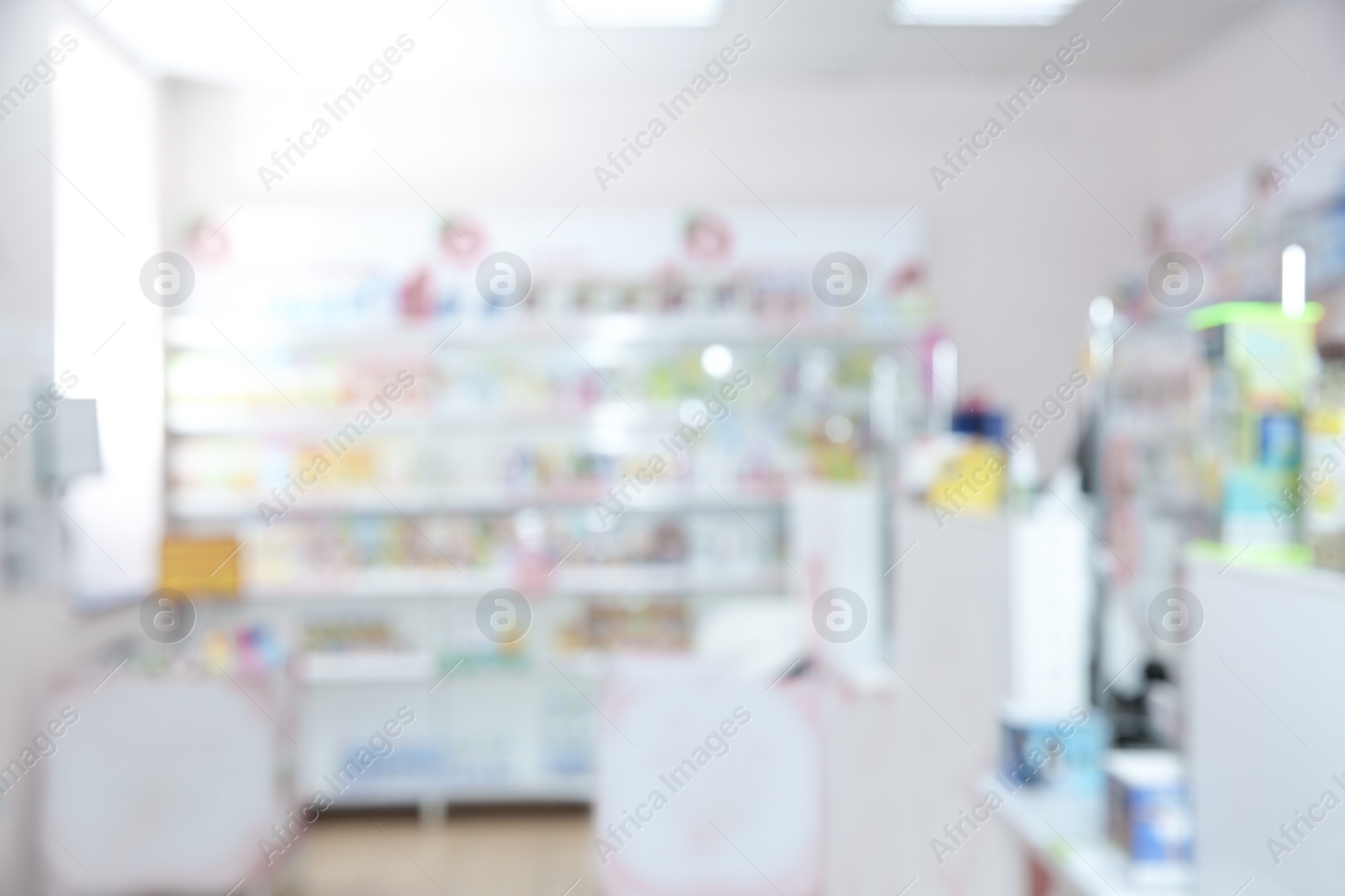 Image of Pharmacy interior with different pharmaceuticals, blurred view