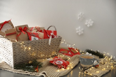 Set of gifts, coffee and Christmas decor on table. Advent calendar