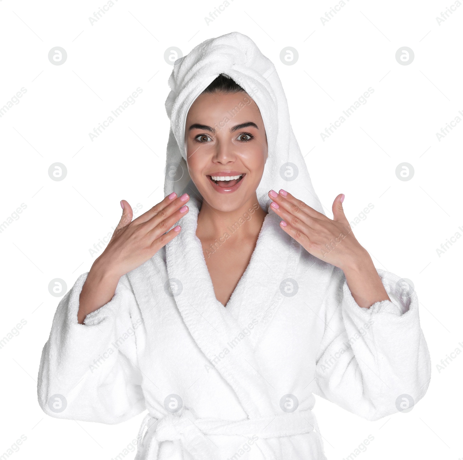 Photo of Beautiful young woman wearing bathrobe and towel on head against white background