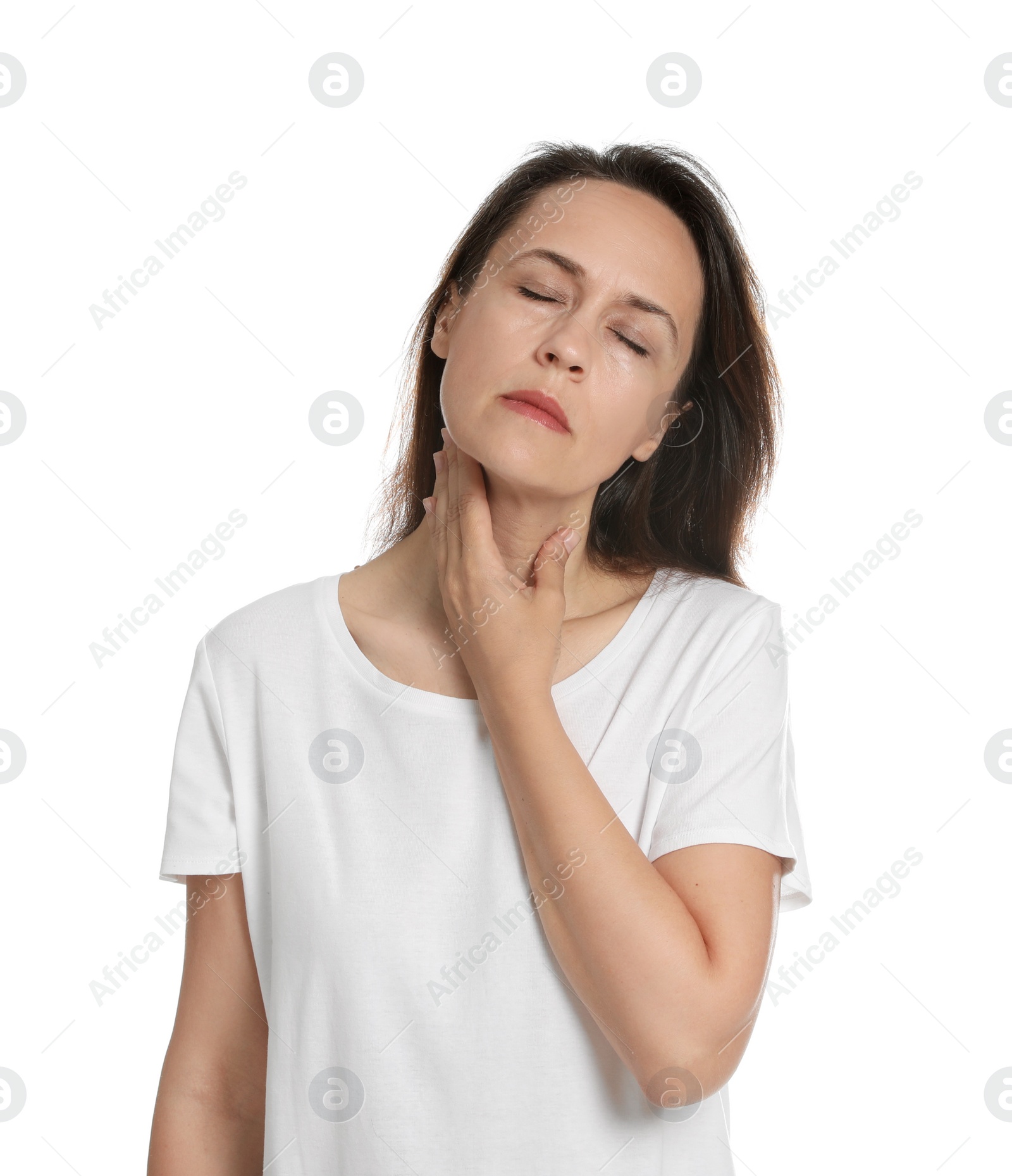 Photo of Mature woman doing thyroid self examination on white background