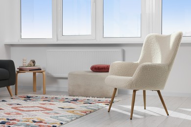 Photo of Living room with beautiful carpet and furniture