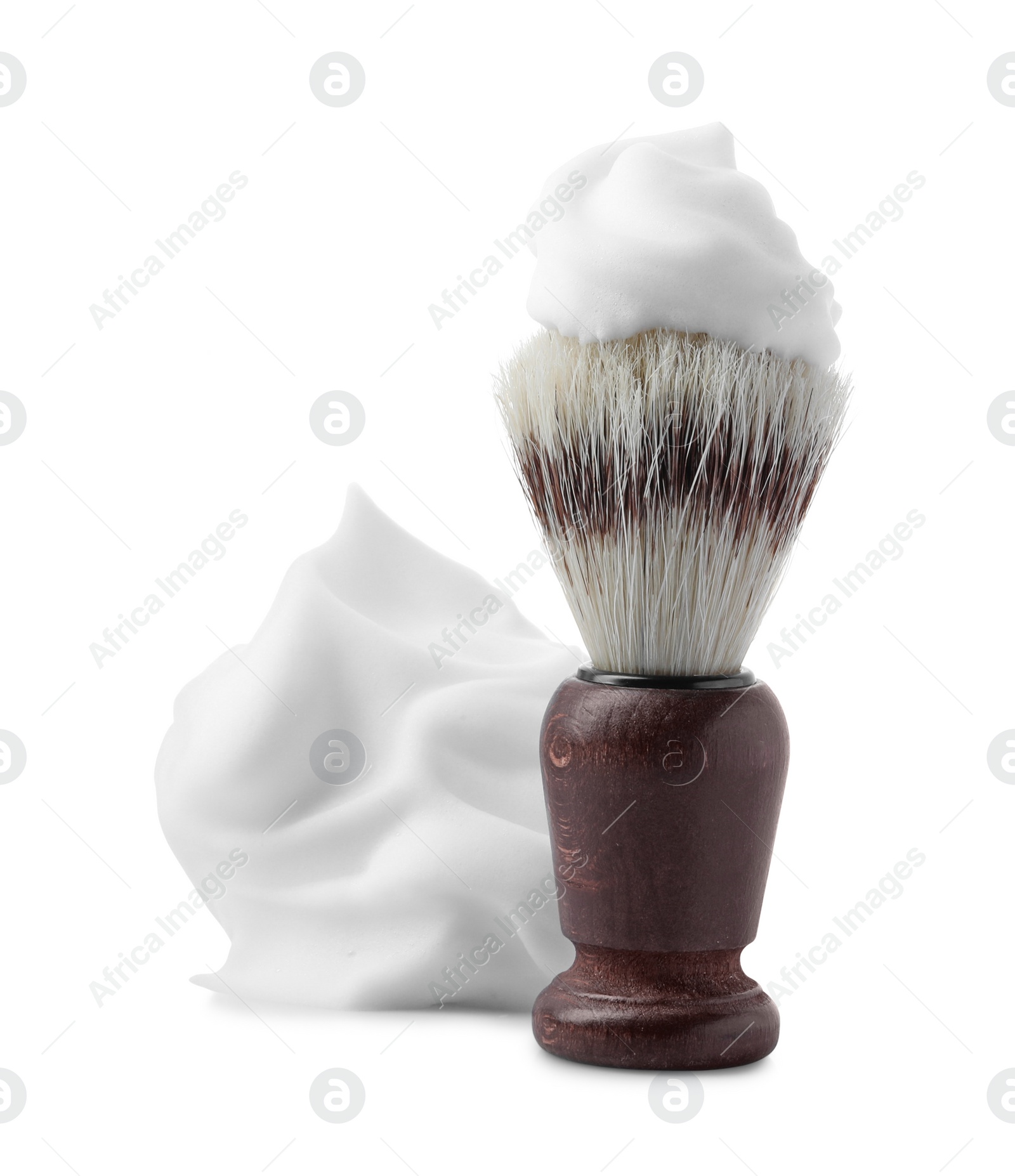Photo of Shaving foam and brush on white background