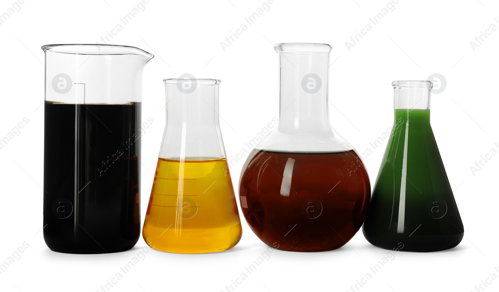 Photo of Beaker and flasks with different types of oil isolated on white