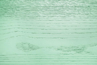 Image of Texture of wooden surface as background. Image toned in mint color 