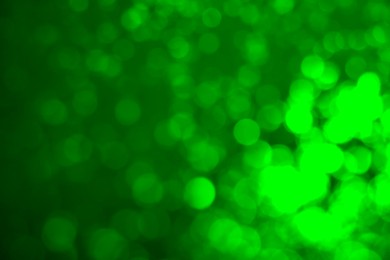 Image of St. Patrick day. Green background with blurred lights, bokeh effect