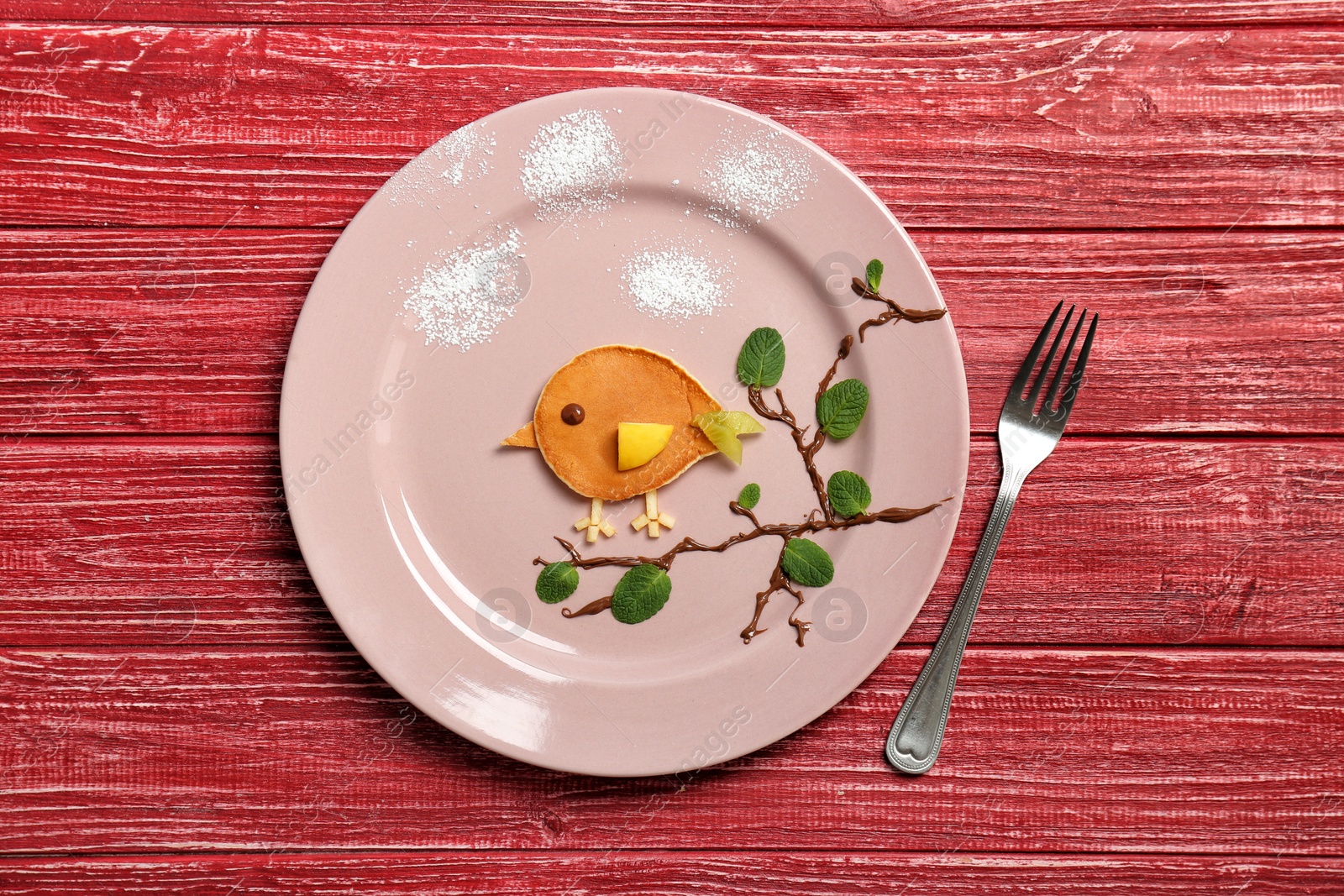 Photo of Flat lay composition with pancake in form of bird on wooden background. Creative breakfast ideas for kids