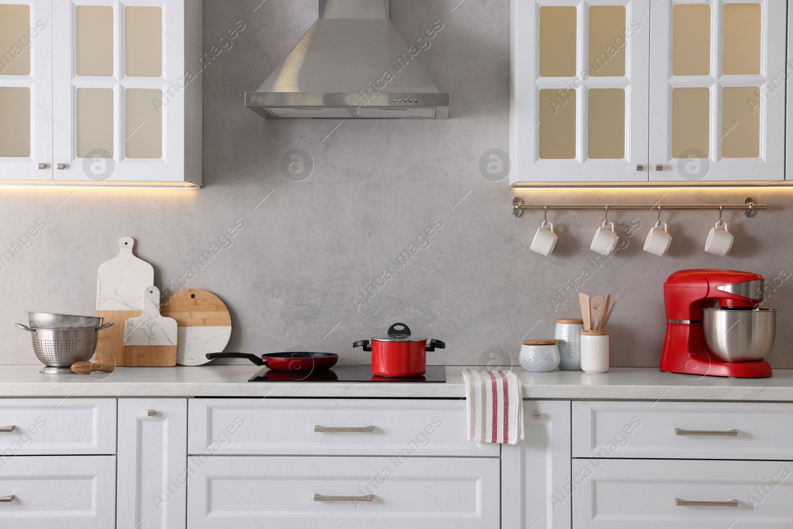 Photo of Set of different utensils on countertop in kitchen