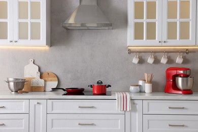 Set of different utensils on countertop in kitchen