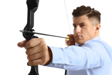 Photo of Businessman with bow and arrow practicing archery against white background, focus on hand