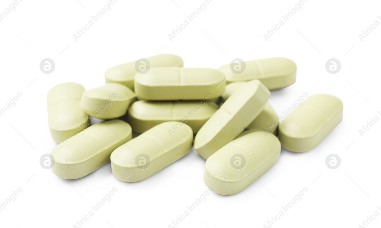 Photo of Light green vitamin pills isolated on white