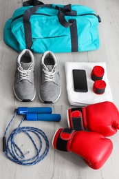 Photo of Composition with sports bag on wooden floor