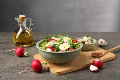 Delicious radish salad and ingredients on grey table