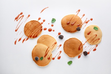 Photo of Flat lay composition with tasty pancakes on light background