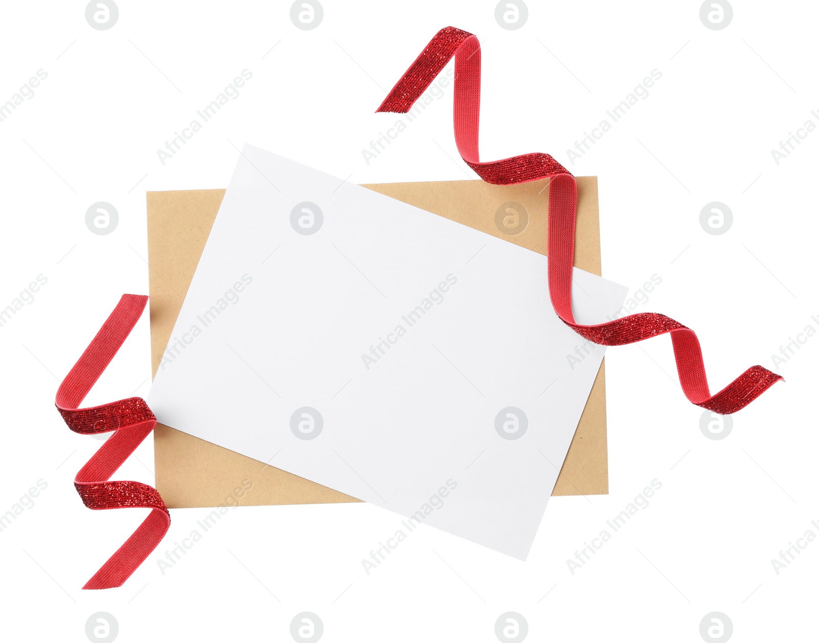 Photo of Blank card, envelope and red ribbons on white background, top view. Valentine's Day celebration