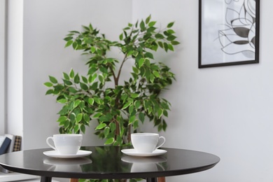 Tea cups on table indoors. Interior element