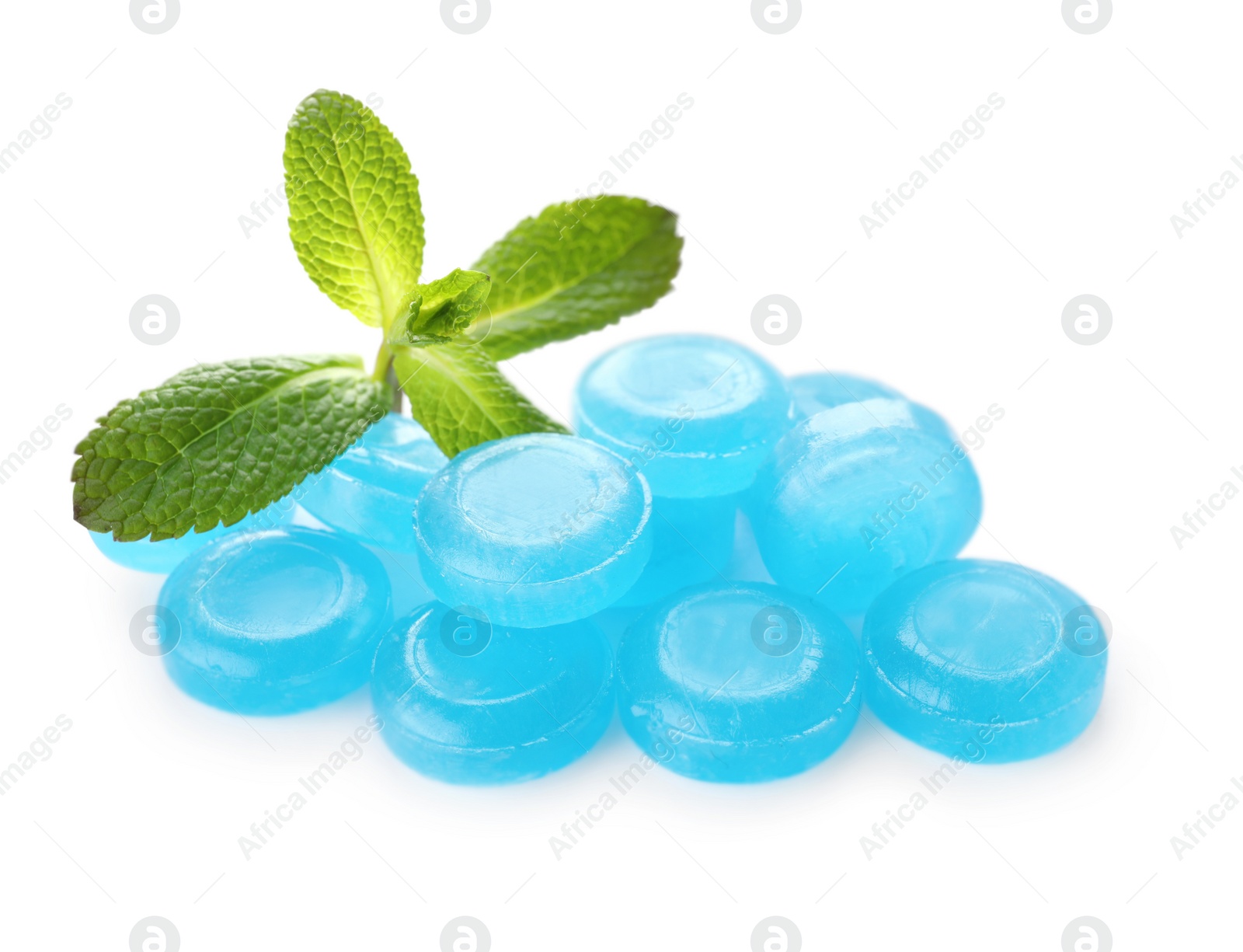 Photo of Many light blue cough drops with mint on white background
