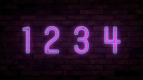 Image of Glowing neon number (1, 2, 3, 4) signs on brick wall