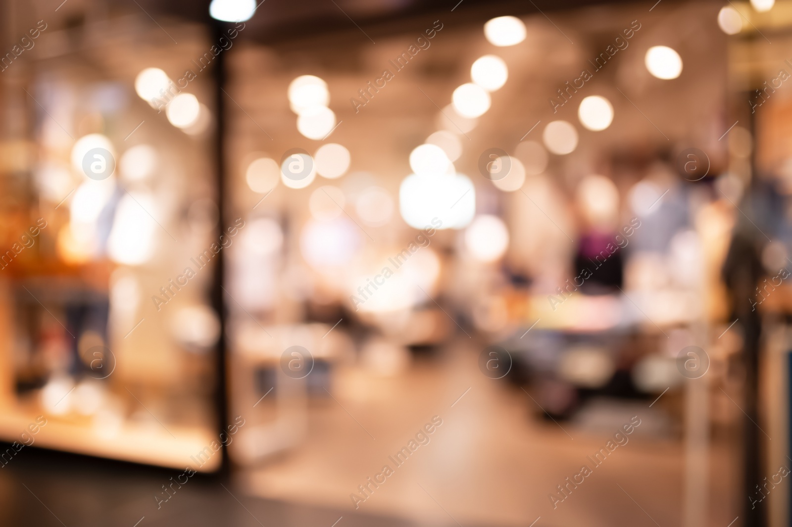 Photo of Blurred view of modern shopping mall interior