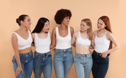 Photo of Group of beautiful young women on beige background